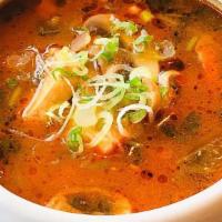 Tom Yum Soup · Thai spicy soup served with shrimp or chicken, mushroom, tomato, topped with scallion, and c...