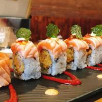 Weymouth Cowboy · Shrimp tempura and cucumber., topped with torched salmon, crispy basil, and special sauce.