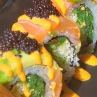 War Green Roll · Seaweed salad, tempura flakes, cucumber, topped with salmon, avocado, black tobiko, and spic...