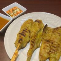 Chicken Satay (4 Pieces) · Grilled chicken on skewers marinated in special sauce served with peanut sauce, sweet and so...