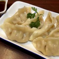 Steamed Gyoza (6 Pieces) · Chicken dumplings served with sweet ginger sauce.