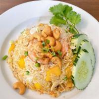 Mango Fried Rice · Fried rice with chicken,  shrimp, egg, mango chunk, ginger, onions, cashew nut and carrot.