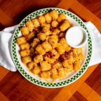 Texas Tater Tots · Melted cheese, ranch dressing, and bacon.