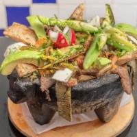 Molcajete Cielo Mar Y Tierra · Comes with a salsa sofrito (green tomatoes and jalapeño), melted chihuahua cheese, cactus, g...