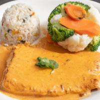 Salmon En Crema De Chipotle · Salmon covered in a chipotle cream sauce. Served with steamed vegetables and rice.