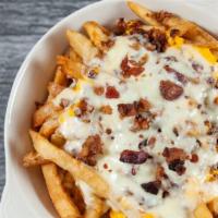 Krazy Fries · Topped with cheddar cheese sauce, mozzarella and bacon bits, served with ranch.