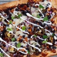 Bbq Chicken Flatbread · Grilled chicken, black beans, mozzarella, jalapenos, red onions, BBQ sauce and sour cream on...