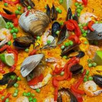 Paella De Mariscos · Saffron rice, clams, mussels, calamari, shrimp.