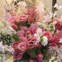 Soft & Feminine · Combination of soft palate flowers including roses and orchids.