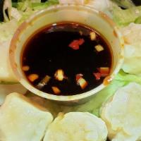 Shumai · Steamed shrimp dumpling with special sauce.