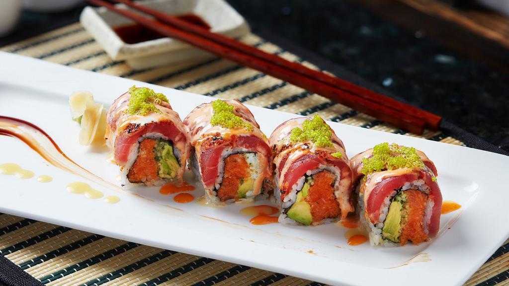 G-Vegas  · Spicy salmon, avocado, cucumber inside topped with sealed black pepper tuna, wasabi tobiko, spicy mayo and wasabi mayo