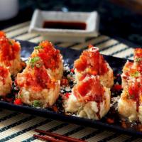 Volcano Roll  · Crabmeat, white fish, asparagus deep fried, spicy tuna on top with eel sauce,  spicy mayo, m...