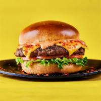 Blazed Og Cheetos Burger · Juicy beef burger patty with American cheese and Hot Cheetos dust, fresh lettuce and sliced ...