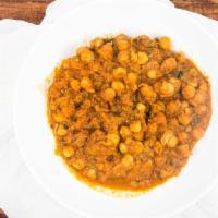 Chana Masala · Garbanzo beans (chana) cooked in a delicious sauce made of ginger, garlic, onions, tomatoes,...