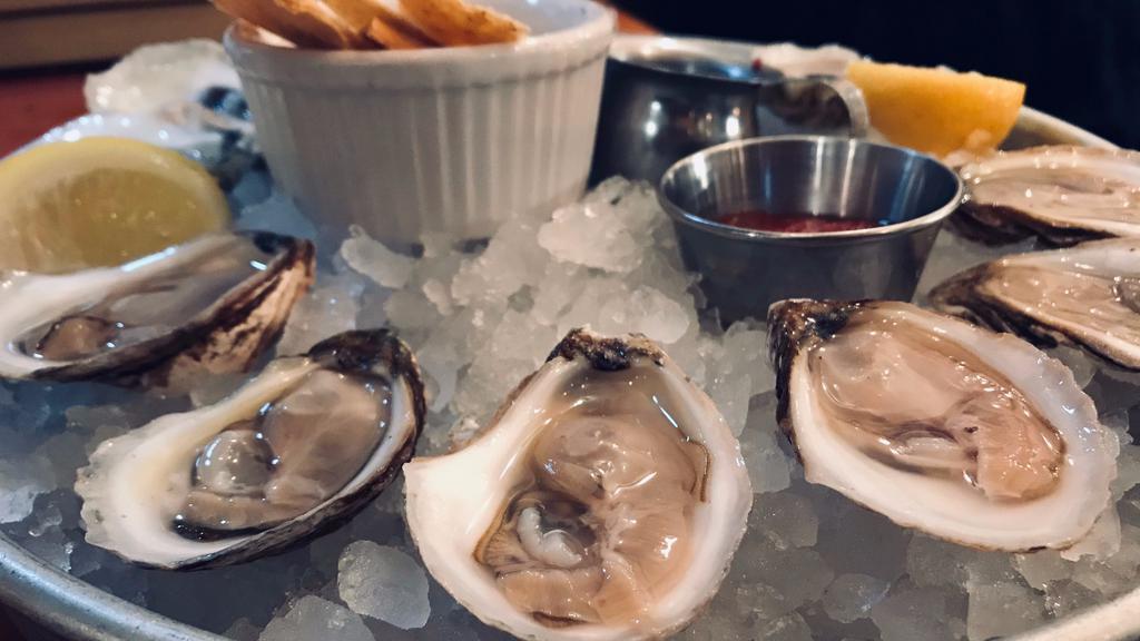 Boutique Oysters · Half a dozen of our boutique oysters from today's list. Served on a bed of crushed ice with cocktail sauce and mignonette.