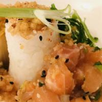 Ora King Salmon Poke · Sweet sushi rice, chile and ginger vinaigrette, house-made kimchi, wakame, crispy tempura.