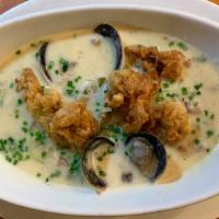 New England Clam Chowder · House Smoked Bacon**, Leeks, Fried Ipswich Clams

** Pork cannot be removed from this dish.