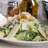 Caesar · Romaine lettuce, croutons, shaved parmesan and housemade Caesar dressing.