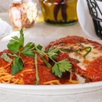 Eggplant Parmesan (Small) · Fried eggplant topped with
fresh mozzarella and fresh basil and served with
spaghetti in hom...