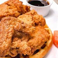 Fried Chicken & Waffles · Country fried chicken, Belgian style waffles, served with syrup and fresh fruit.