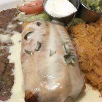 Tex-Mex Chimichanga · Choice of shredded chicken, chorizo, ground beef, barbacoa or pork carnitas. Topped with our...