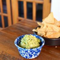 Guacamole · Served with cilantro, jalapeños, onions, tomatoes, and lime juice.