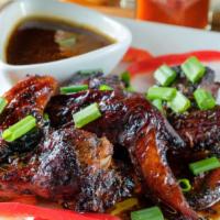 Jerk Chicken Wings · The combination of spicy peppers, garlic, spices, and brown sugar creates the perfect balanc...