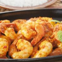Curry Shrimp · Shrimp cooked in a curry sauce with the finest herbs and vegetables seasoned to perfection.