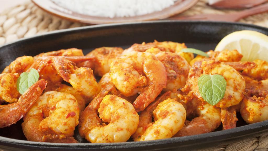 Curry Shrimp · Shrimp cooked in a curry sauce with the finest herbs and vegetables seasoned to perfection.
