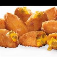 Jalapeno Cheddar Bites · Fried Jalapeno and aged cheddar cheese bites served with a side of ranch.