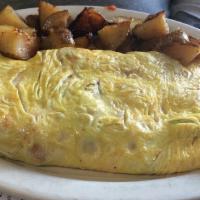 Spanish Omelet · Grilled with tomatoes, onions, roasted peppers, salsa and cheddar cheese.