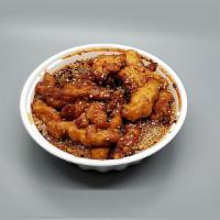 Sesame Chicken · Deep-fried chunks of chicken in your sesame brown sweet sauce. With white rice.