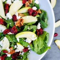 Fields Of Green · Spinach, goat cheese, apples, dried cranberries, candied walnuts, poppy seed vinaigrette.