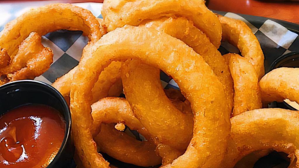 Onion Rings · Thick-cut beer-battered onion rings served with remoulade.