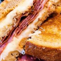 Reuben · Choice of corned beef or turkey, grilled with Swiss, sauerkraut, and 1000 Island on rye, ser...