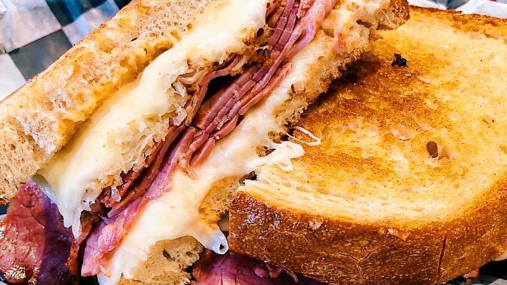 Reuben · Choice of corned beef or turkey, grilled with Swiss, sauerkraut, and 1000 Island on rye, served with choice of Pop fries or tots.