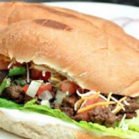 Torta Lamb · comes with refried beans, meat, cheese, lettuce, pico de gallo, jalapenos, avocado, mayonais...