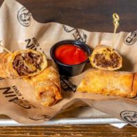 Cheesesteak Egg Rolls · Two hand-rolled egg rolls full of our philly cheesesteak with sautéed onions. Made in-house ...