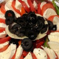 Capri Salad · Plum Tomatoes, Fresh Mozzarella, Roasted Peppers, Basil, Olive Oil, Garlic & Balsamic Vinegar