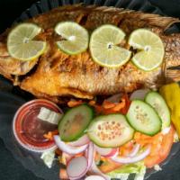 Fish Dinner · Served with salad and your choice of french fries or rice.