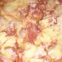 Hawaiian · Baked ham & sliced pineapple, mozzarella & romano cheese with our blend of tomato sauce.