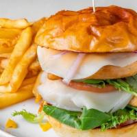 Classic Chicken Sandwich · Chicken breast with cheese, lettuce, tomato, red onions, and pickles.