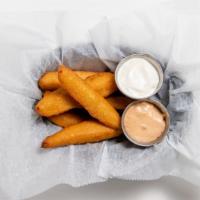 Fried Pickles · dill pickle spears fried in spicy beer batter, served with homemade ranch & spicy chipotle a...