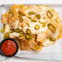 Cheese Nachos · crisp house-made tortilla chips loaded with cheese & jalapeños, served with salsa
