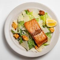 Seared Salmon Caesar · crisp romaine lettuce and garlic croutons, tossed with Parmesan cheese & Caesar dressing