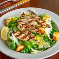 Grilled Chicken Caesar  · crisp romaine lettuce and garlic croutons, tossed with Parmesan cheese & Caesar dressing