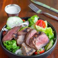 House Salad With Steak · seasonal greens with cuke, tomato, red onion, and lemon vinaigrette