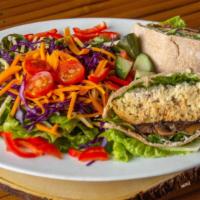 Chickpea Mushroom Burger · Sprouted chickpea portabella veggie burger, with herb mayo, lettuce, onions, and tomatoes in...