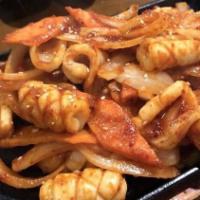 Stir-Fried Spicy Squid · Stir-fried Squid Squid stir-fried with onions, carrots, and cabbage in a spicy mixture of go...