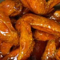 Small Fusion(10 Wings) · 10 golden chicken wings fried and tossed in fusion sauce.
